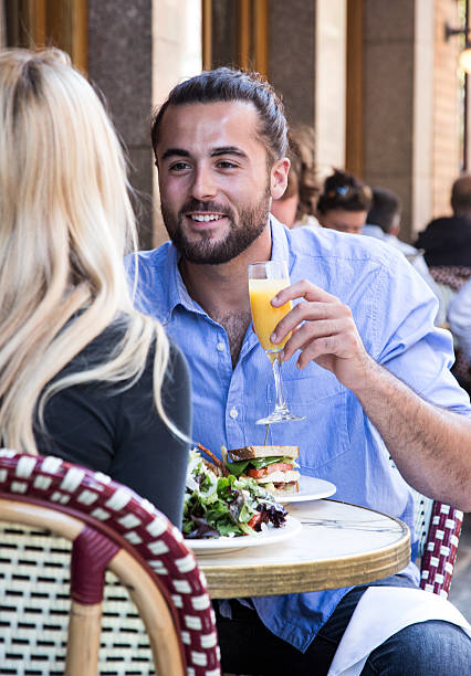 istock Young Couple eating at an Outdoor Restaurant 609060294