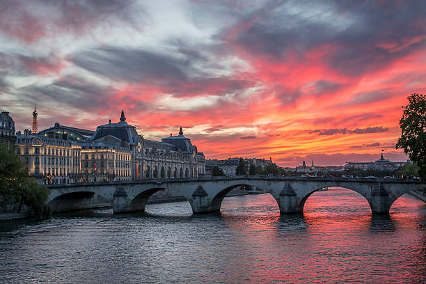 Red evening in Paris Red afterglow over the River Seine in Paris, France musee dorsay stock pictures, royalty-free photos & images