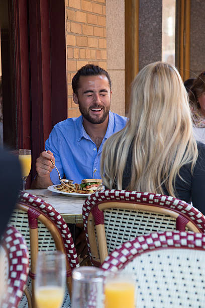 istock Young Couple eating at an Outdoor Restaurant 609060966