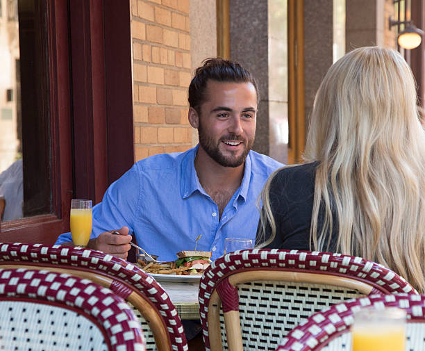istock Young Couple eating at an Outdoor Restaurant 609061488