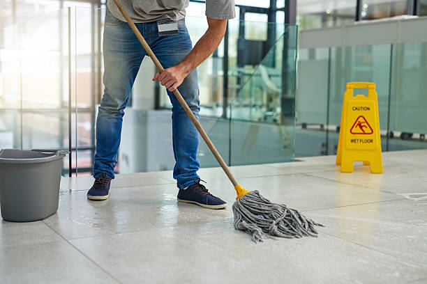 He'll leave that floor spotless Shot of an unrecognizable man mopping the office floor custodian stock pictures, royalty-free photos & images