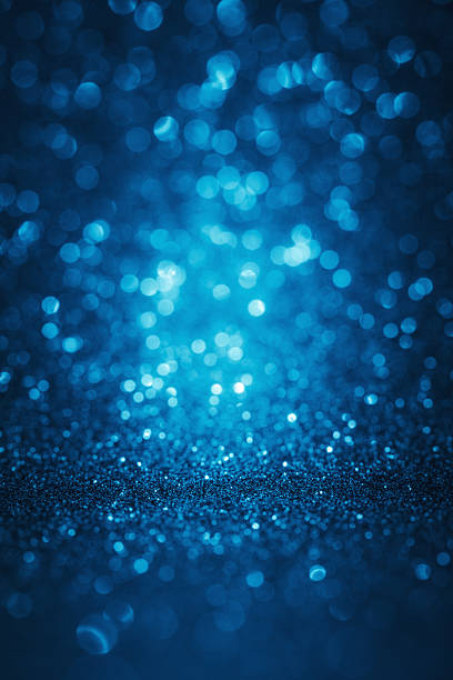 Blue glitter defocused lights abstract background stock photo