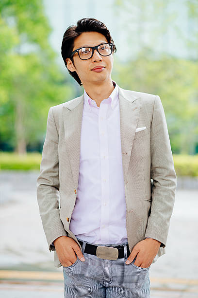 istock Young man in suit in Tokyo financial downtown 609069622