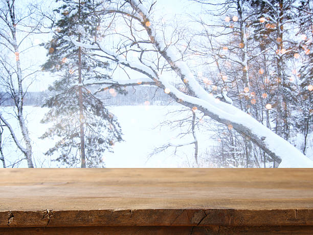 istock Empty wooden table in front of dreamy winter landscape 609073330