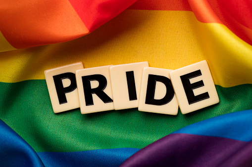 Photograph of the LGBT rainbow flag, lesbian, gay, bisexual and transgender with the word pride