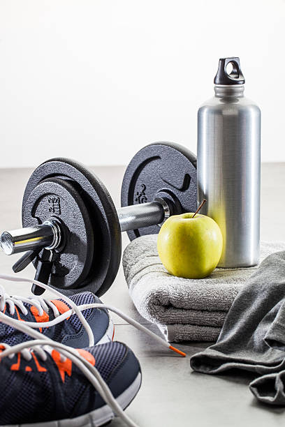 istock to work out with dumbbells, aluminium bottle and healthy apple 609076948