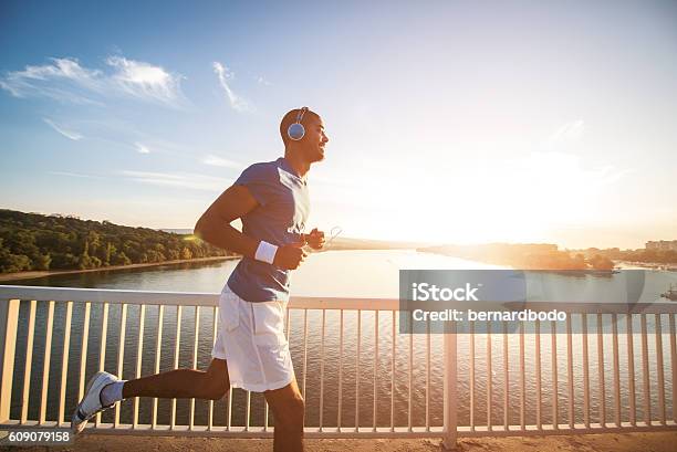 Beautiful Sunset Run Stock Photo - Download Image Now - Running, Men, Track Event