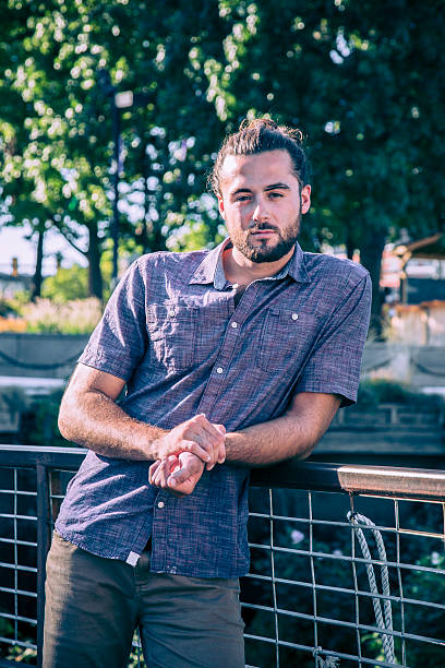 istock Young Man with Hair Bun and Beard 609080502