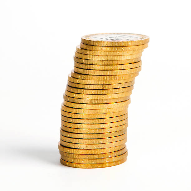 istock Crooked Stack of Shiny Gold Coins Isolated 609081316