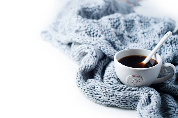 istock Cup of coffee and warm scarf 609081500