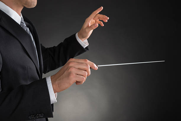istock Person Directing With A Conductor's Baton 609084208