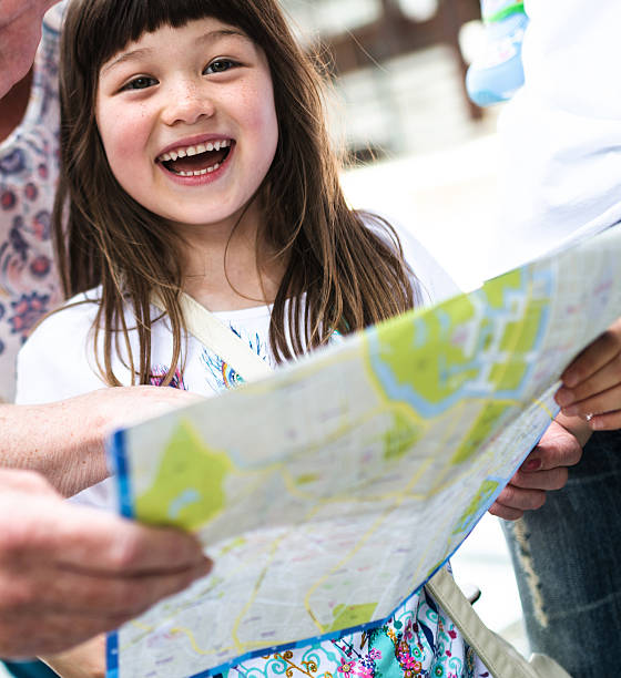 istock happiness mixed race japanese family looing the map 609084646