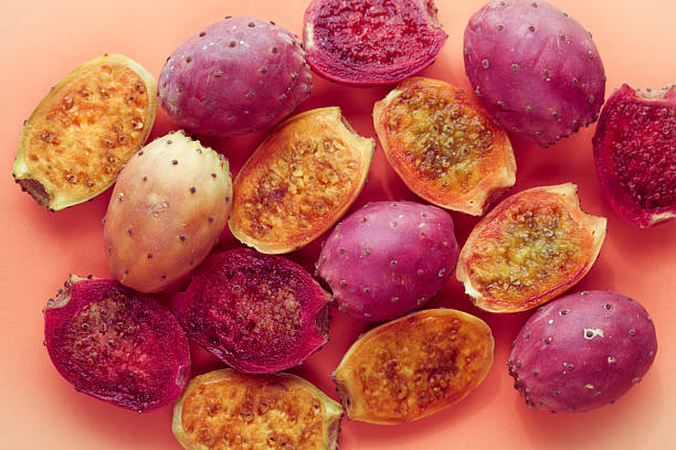 Indian figs still life indian figs still life on solid orange color background with copy space nopal fruit stock pictures, royalty-free photos & images