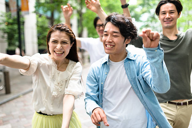 istock japanese friends walking in tokyo 609087816