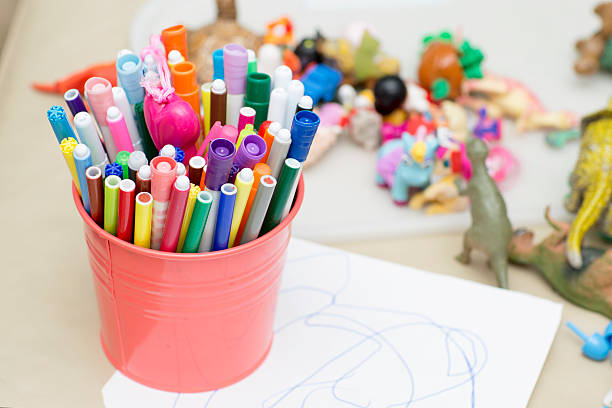 istock Colored markers are in the pink bucket. 609087946