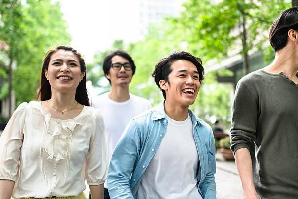 istock japanese friends walking in tokyo 609088006