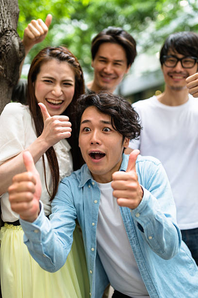 istock japanese friends walking in tokyo 609088114