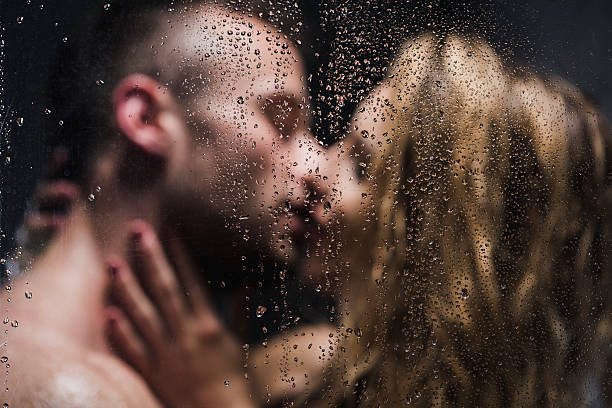 nobody is kissing like you - infidelity sensuality couple men imagens e fotografias de stock