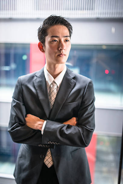 istock businessman standing in the office corridor 609088442