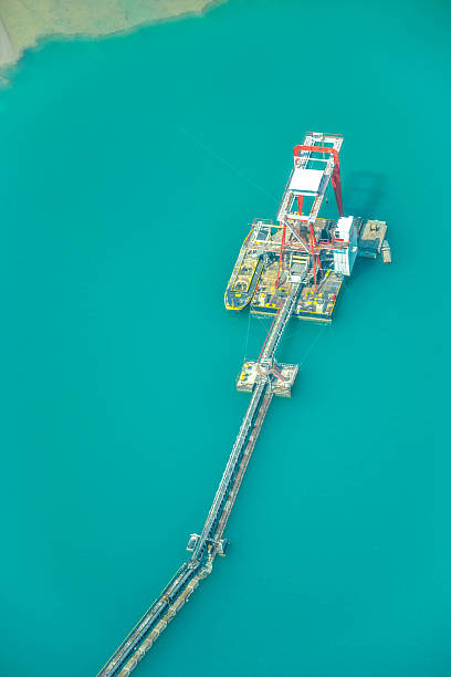istock Gravel harverster on sapphire lake 609088852