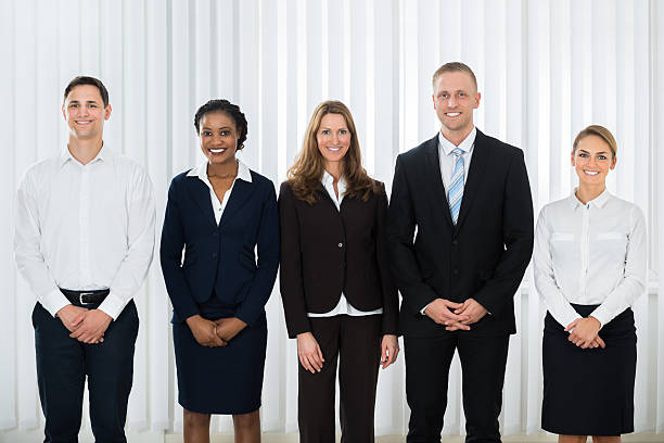 istock Happy Businesspeople At Workplace 609088892