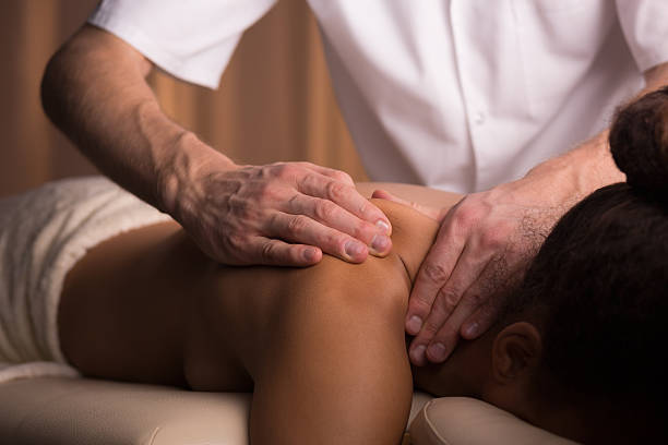istock Treating her injury during a medical massage 609089560