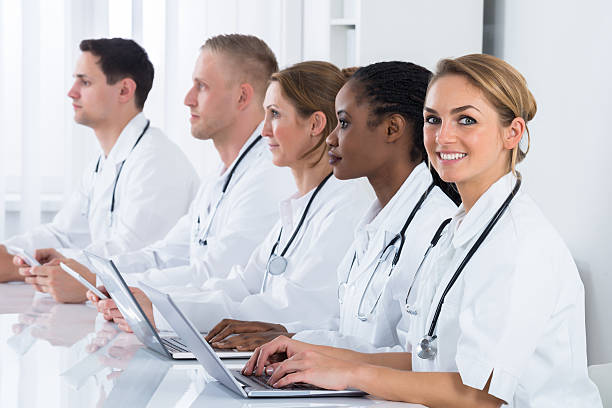 istock Female Doctor Working With Her Colleagues 609089932
