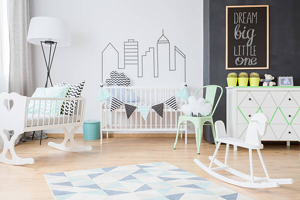 istock Minimalistic decorations in modern baby room 609090498