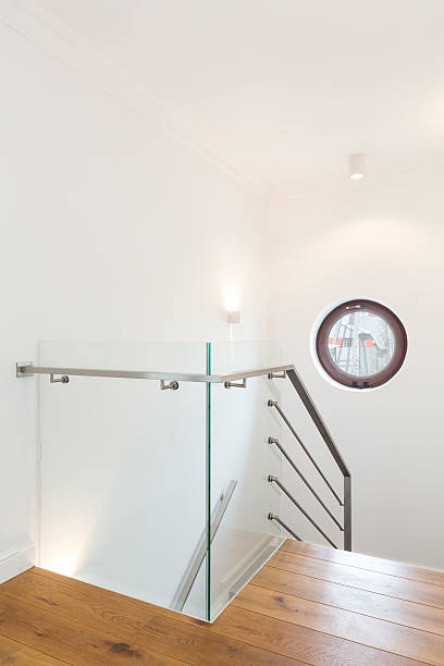 istock Minimalist stairway leading down to modern interiors 609090878