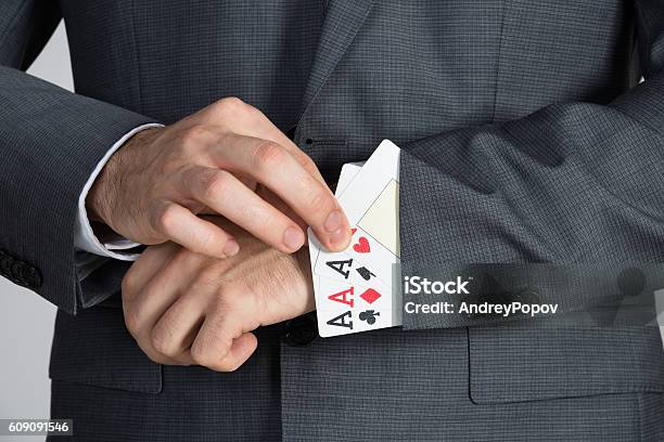Businessman Removing Ace Cards From Sleeve Stock Photo - Download Image Now - Ace, Hiding, Adult