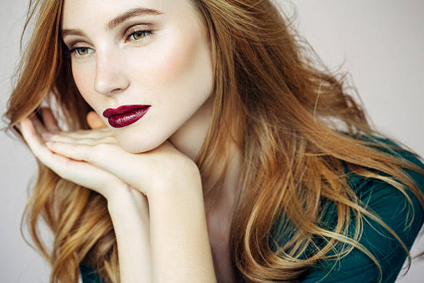Studio shot of young beautiful woman. Professional make-up and hairstyle. 
