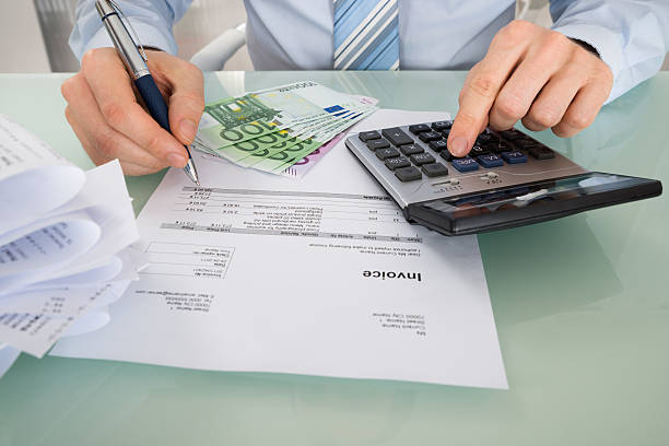 istock Businessman Calculating Invoice In Office 609091790