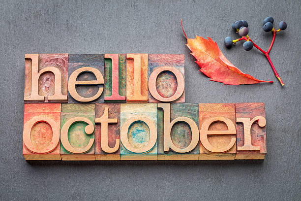 hello October word abstrtact in wood type hello October greeting card - letterpress wood type blocks against gray slate stone hello single word photos stock pictures, royalty-free photos & images