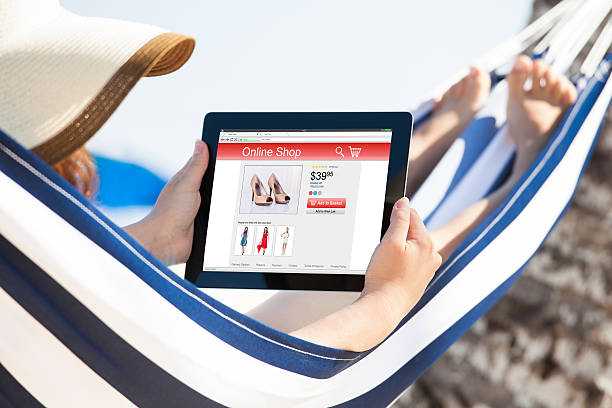 istock Woman Shopping Online While On Hammock 609092420