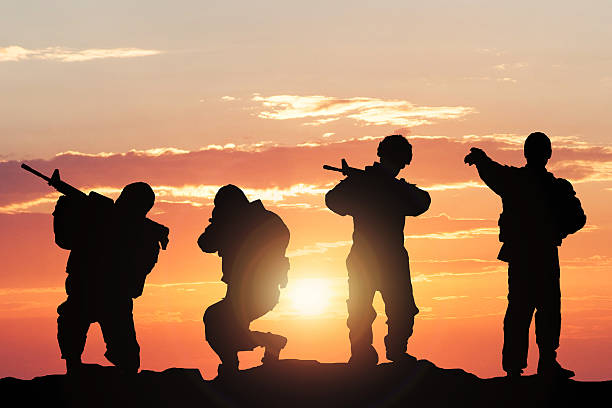 istock Silhouette Of Soldiers On Battlefield 609092492