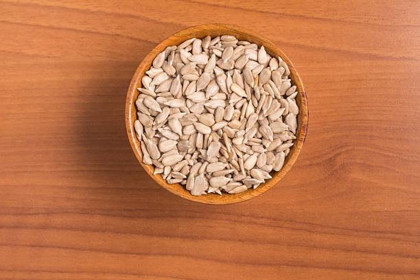 istock Sunflower Seeds into a bowl 609094316