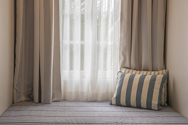 istock Curtain and sofa bed in living room 609095984