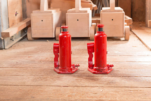 istock red hydraulic  car jack on wooden 609097984
