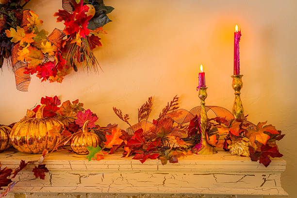 istock Cozy fireplace mantelpiece with fall decorations and candles (P) 609410078