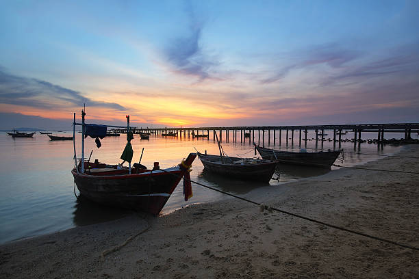 istock Small fishing boats moored beached 609417062