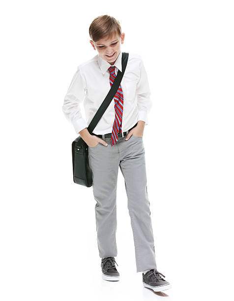 istock Smiling little businessman walking 609421328