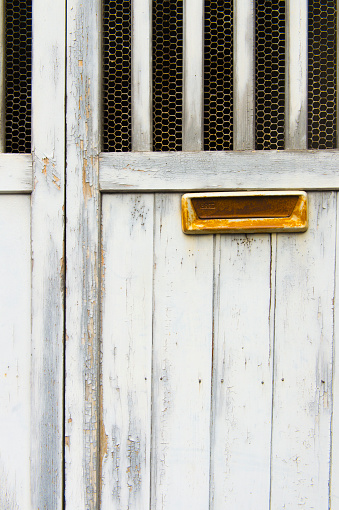 Wooden door and mailbox.
