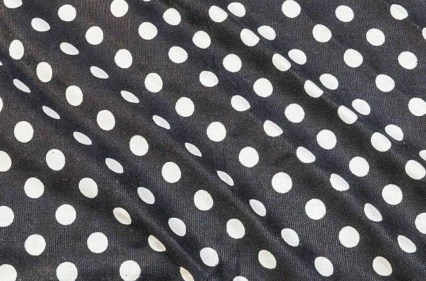 istock Closeup wrinkled fabric handkerchief with white circle dot texture background 609432576