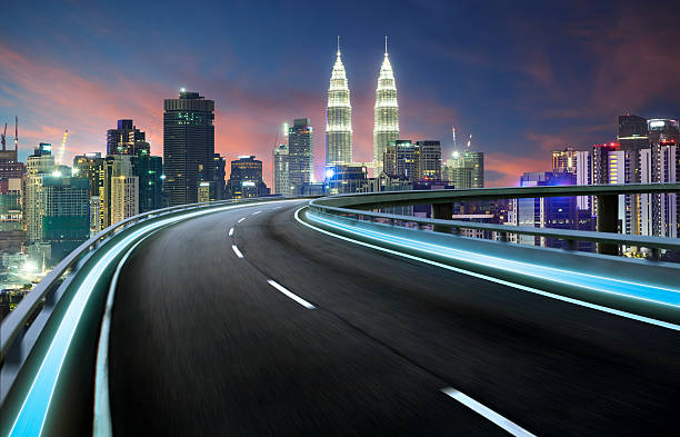 istock Highway overpass motion blur with city background 609433752