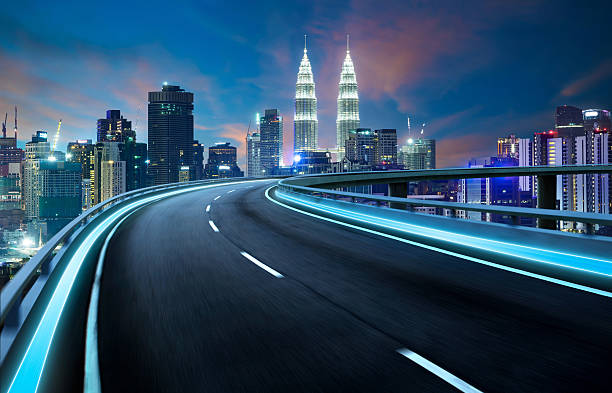 istock Highway overpass motion blur with city background 609433900