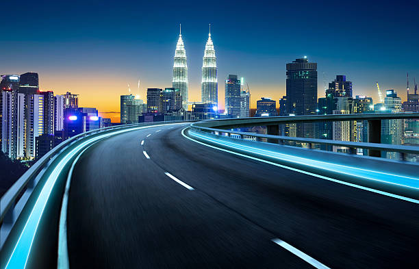 istock Highway overpass motion blur with city background 609434514