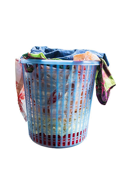 istock Laundry basket with full of clothes, isolated on white background 609435252