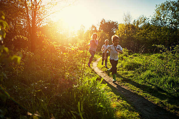 kids running in nature. - carefree joy children only pre adolescent child imagens e fotografias de stock