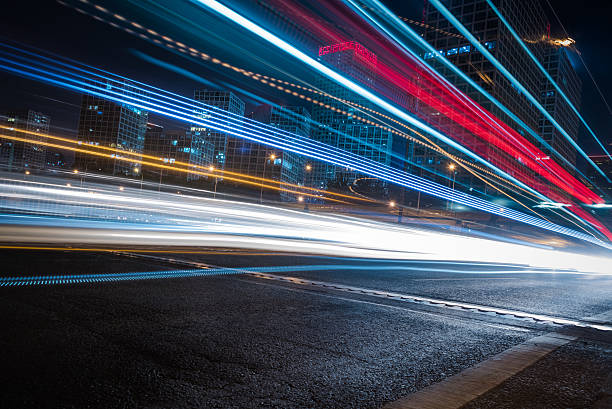 istock blurred traffic light trails on road 609439380