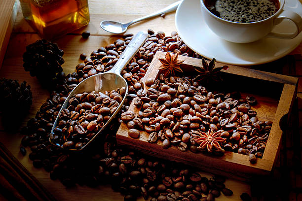 istock Cup of coffee, beans and scoop on old rusty background 609439902